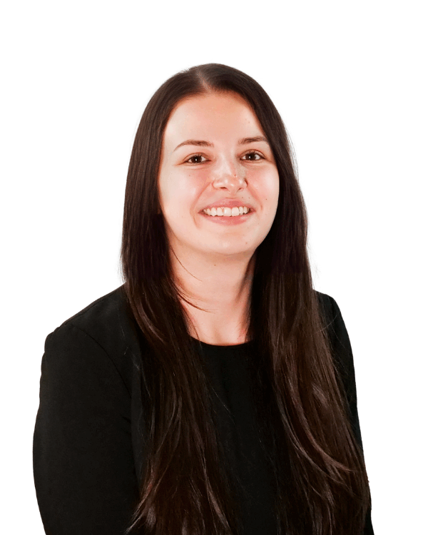 Woman with long straight brown hair, wearing a black top, smiling in front of a white background.