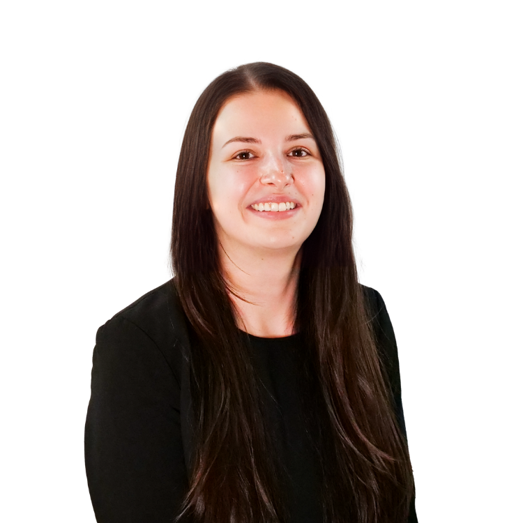 Woman with long straight brown hair, wearing a black top, smiling in front of a white background.