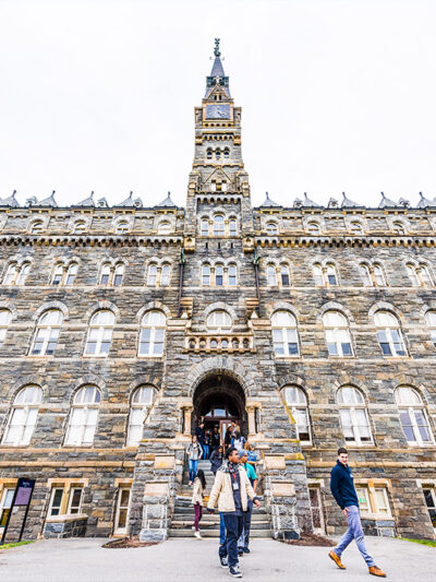 Students exiting a building on the Georgetown University campus.