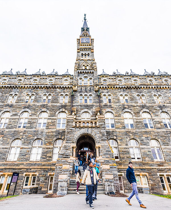 Students exiting a building on the Georgetown University campus.