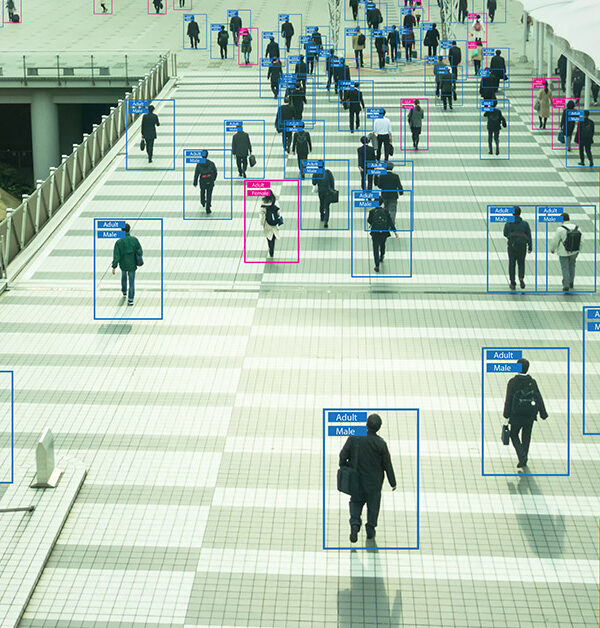 View of people from afar with human recognition markers around them