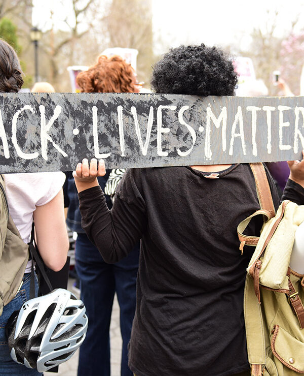 Protestors hold “Black Lives Matter” sign over their shoulders at a rally in Union Square before marching to Lower Manhattan.