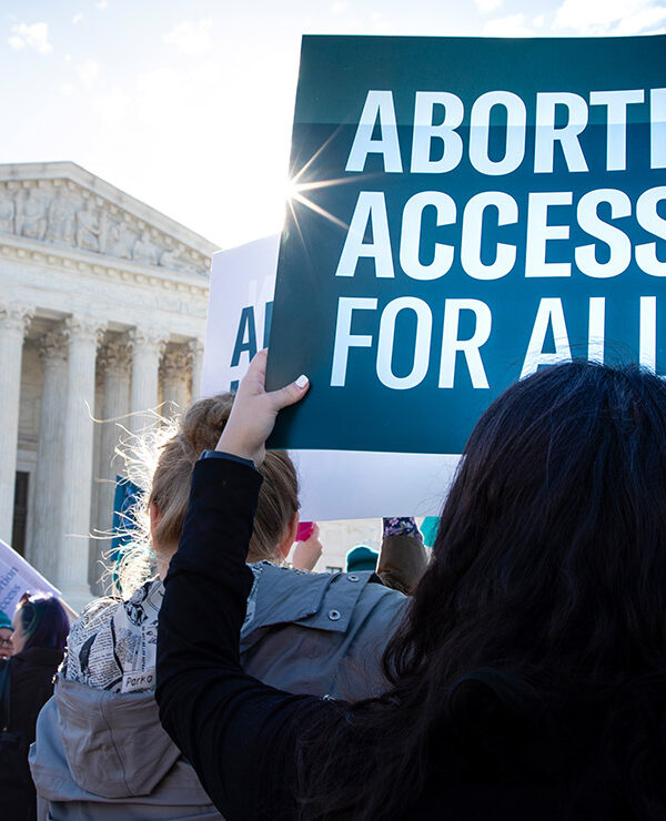 Pro-choice demonstrators outside the Supreme Court with signs advocating abortion access for all.
