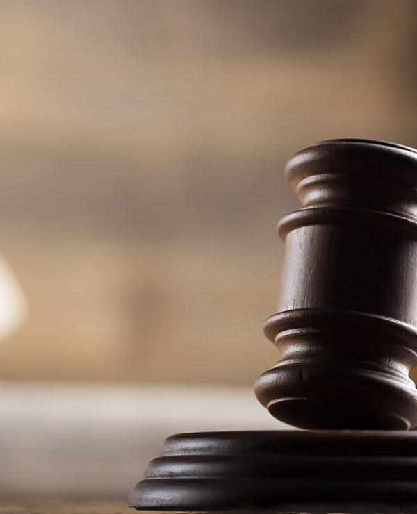 A gavel in a courtroom setting.