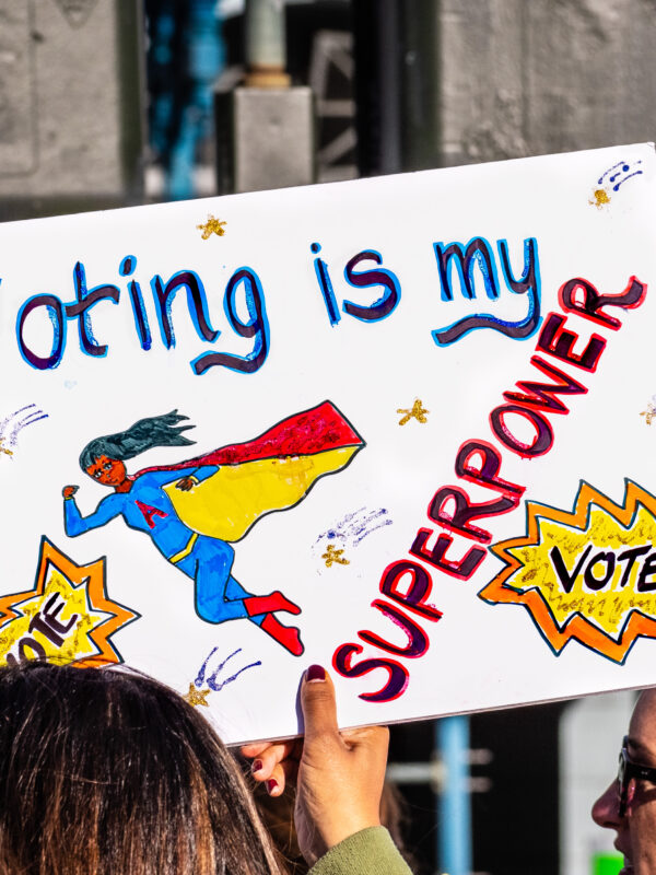 Picture of a protest sign that reads "voting is my superpower"