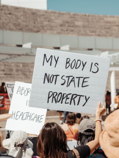 protest sign that says "my body is not state property"