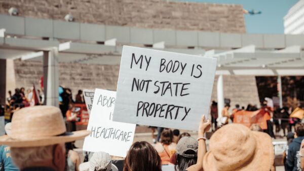 protest sign that says "my body is not state property"