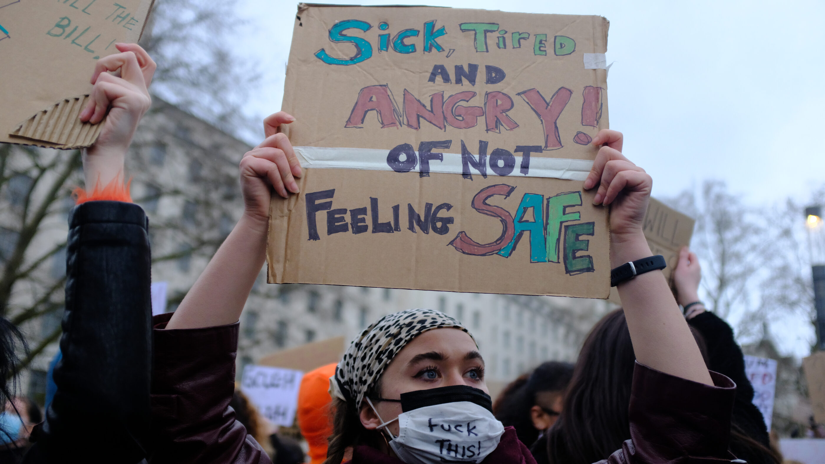 Protest sign that says, "sick, tired and angry of not feeling safe."