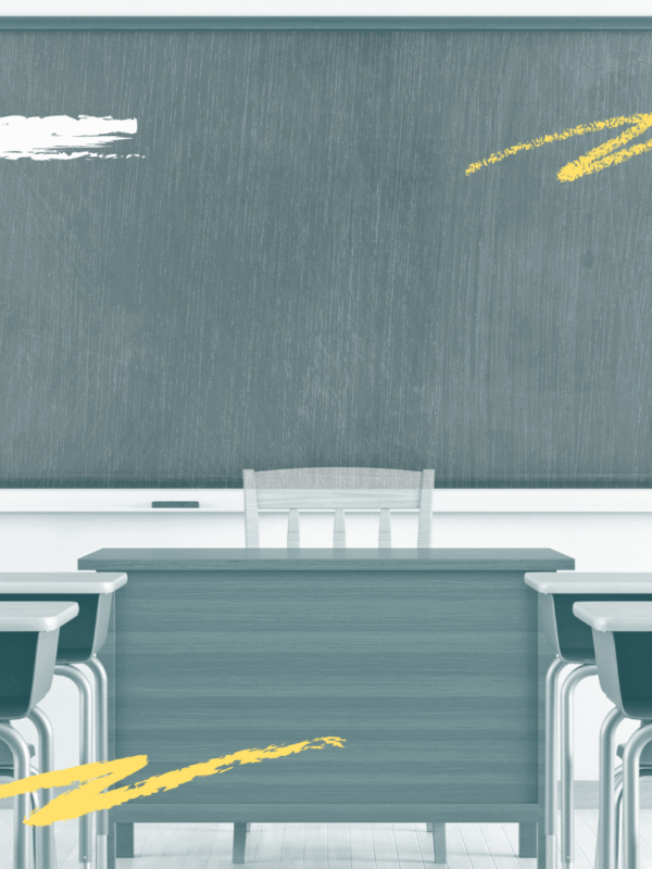 A student in front of a chalk board