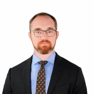 Chris in front of a white background.