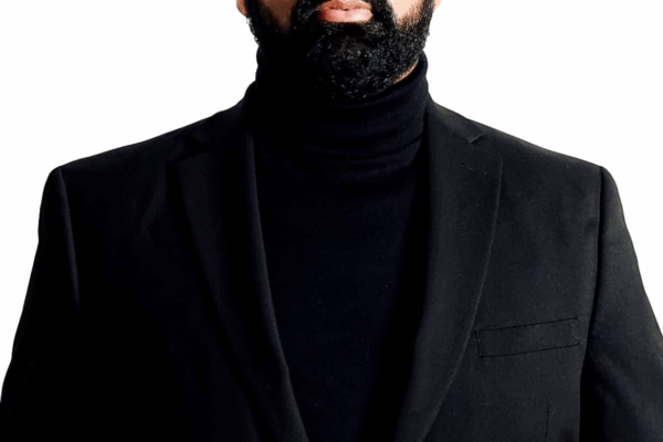 Athar Haseebullah in front of white background.