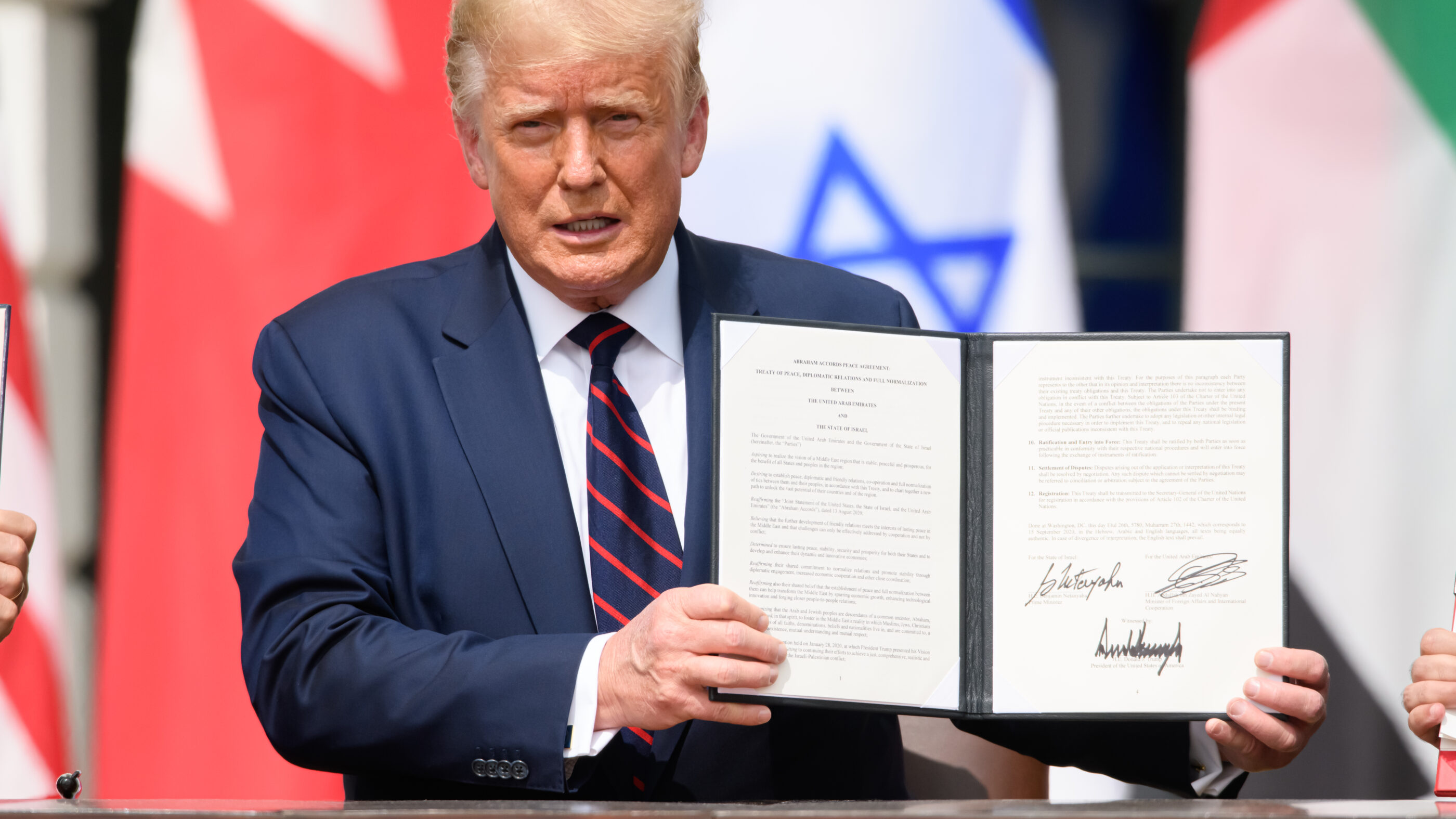 trump holding a signed executive order
