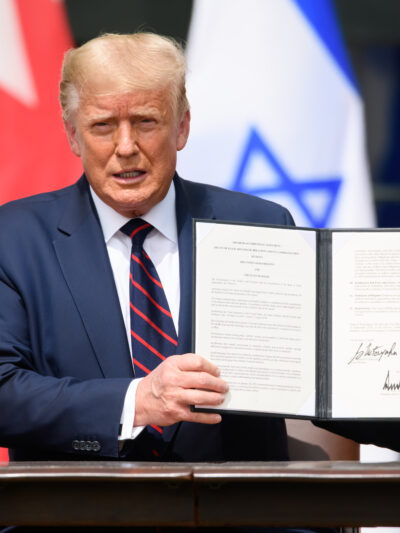 trump holding a signed executive order