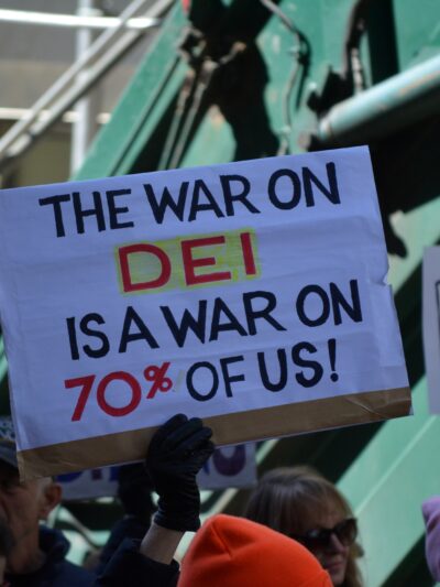A protest sign that reads, "the war on DEI is a war on 70% of us!"