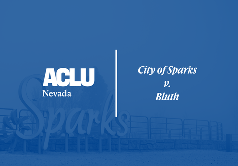 Blue-tinted graphic with the ACLU of Nevada logo and the text ‘City of Sparks v. Bluth.’ The background shows the Sparks city sign and railing along a public walkway.