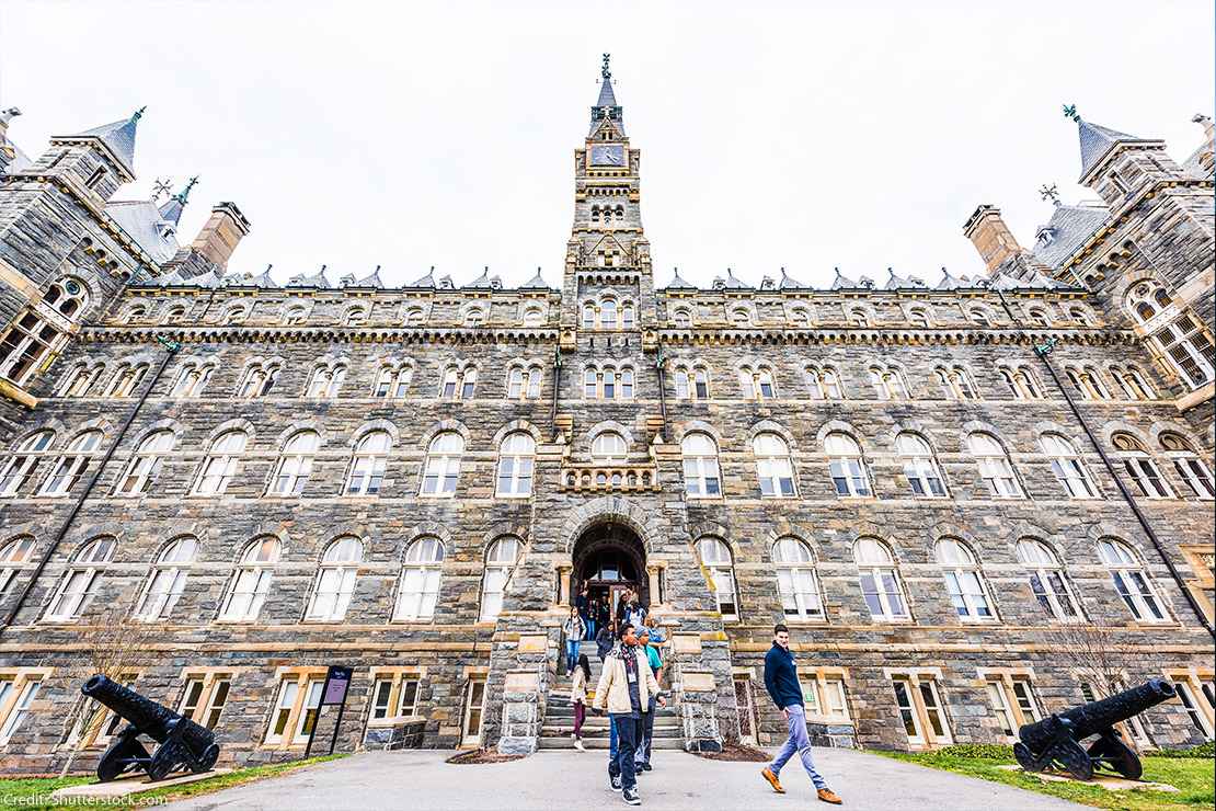 Students exiting a building on the Georgetown University campus.