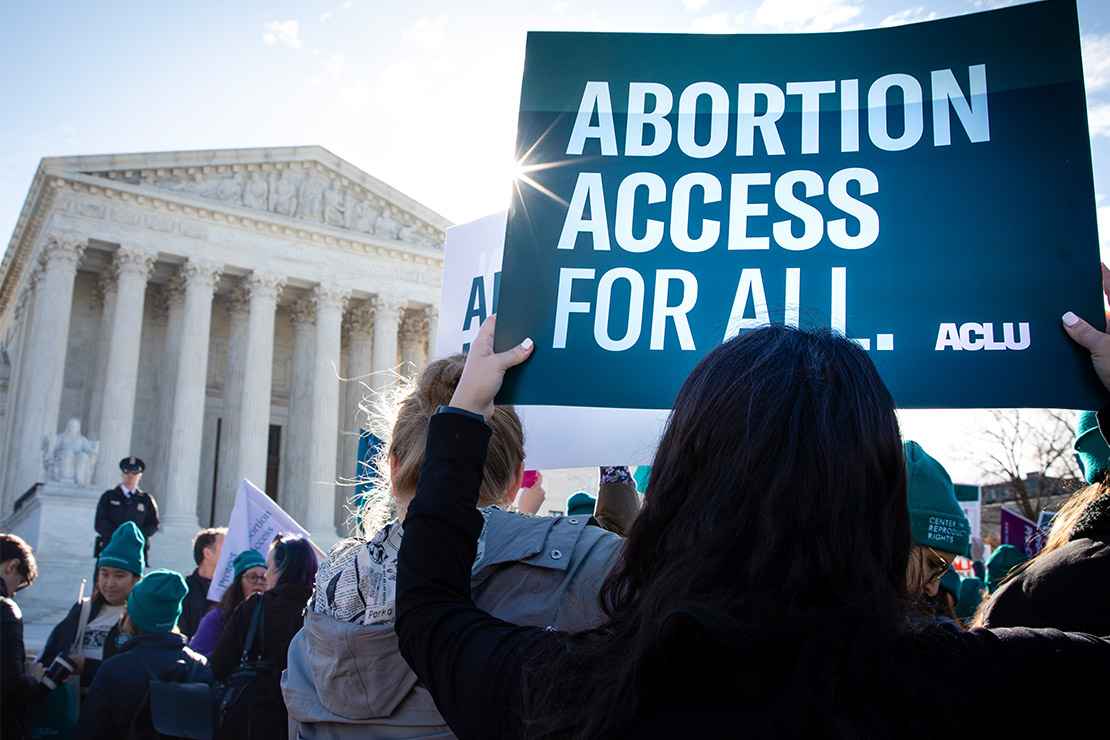 Pro-choice demonstrators outside the Supreme Court with signs advocating abortion access for all.