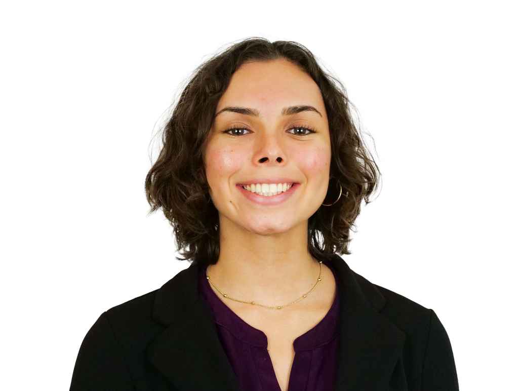 Vanessa in front of a white background.