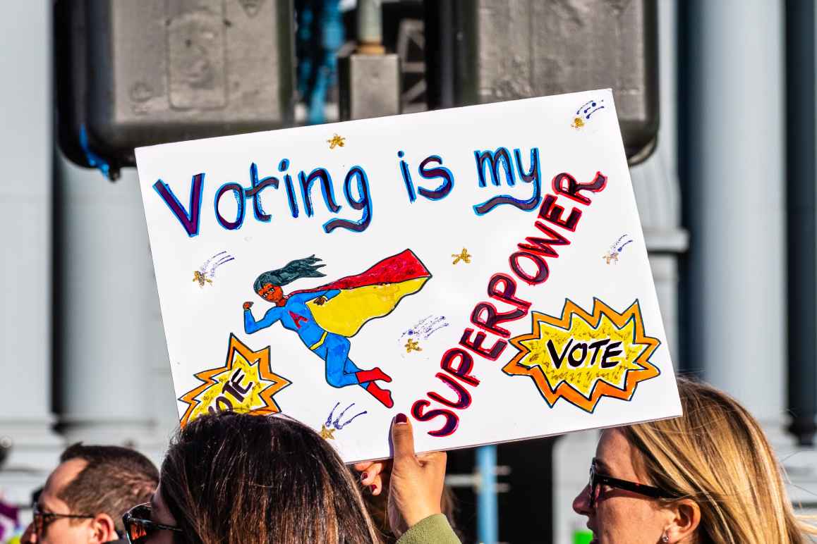 Picture of a protest sign that reads "voting is my superpower"