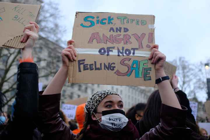 Protest sign that says, "sick, tired and angry of not feeling safe."