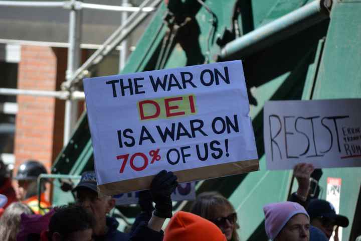 A protest sign that reads, "the war on DEI is a war on 70% of us!"