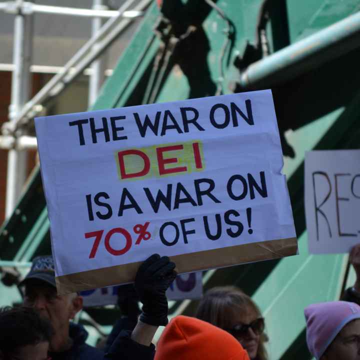 A protest sign that reads, "the war on DEI is a war on 70% of us!"